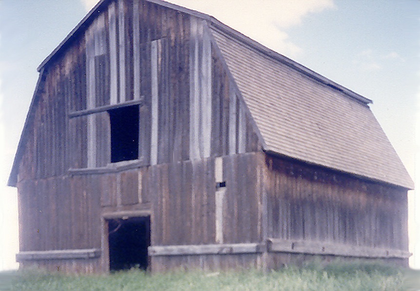 Photo of a weathered red barn