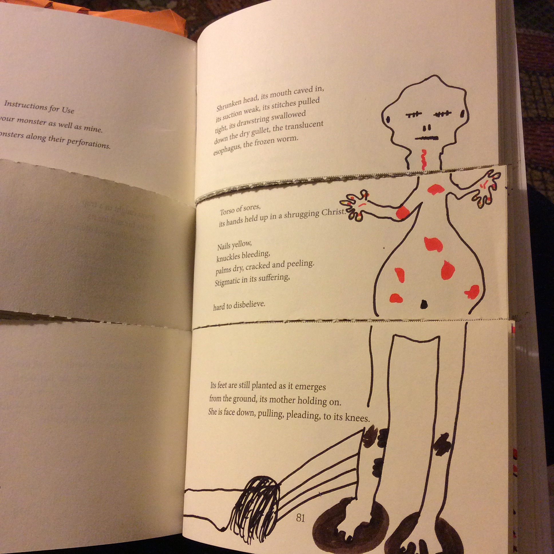 A book open to a spread with a poem (not legible) and a drawing of a monster in the margin.