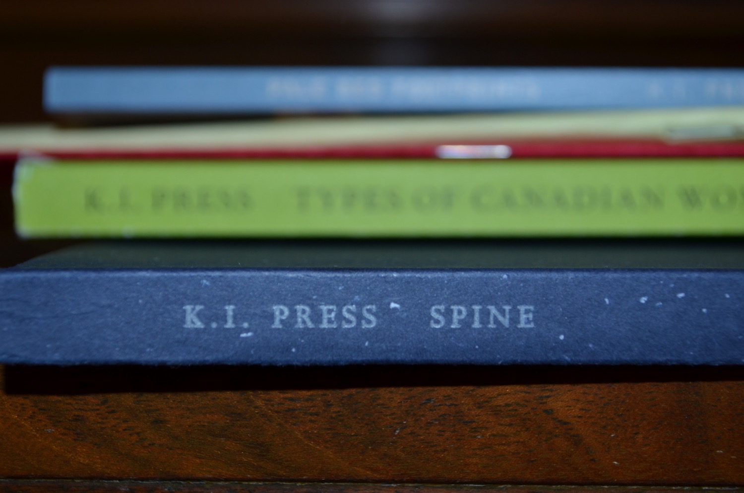 Spine of the book Spine, in a pile of other book spines.