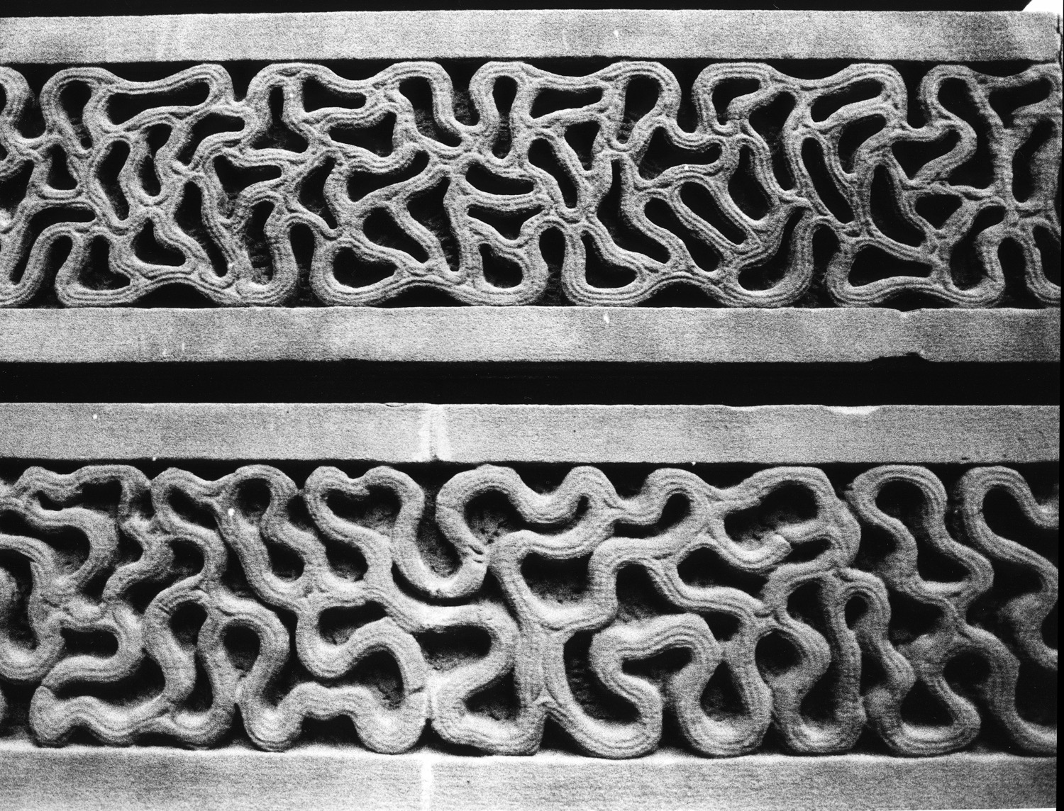 Black and white photo of vermiculation -- vintage stonecarving work that looks likek worms.